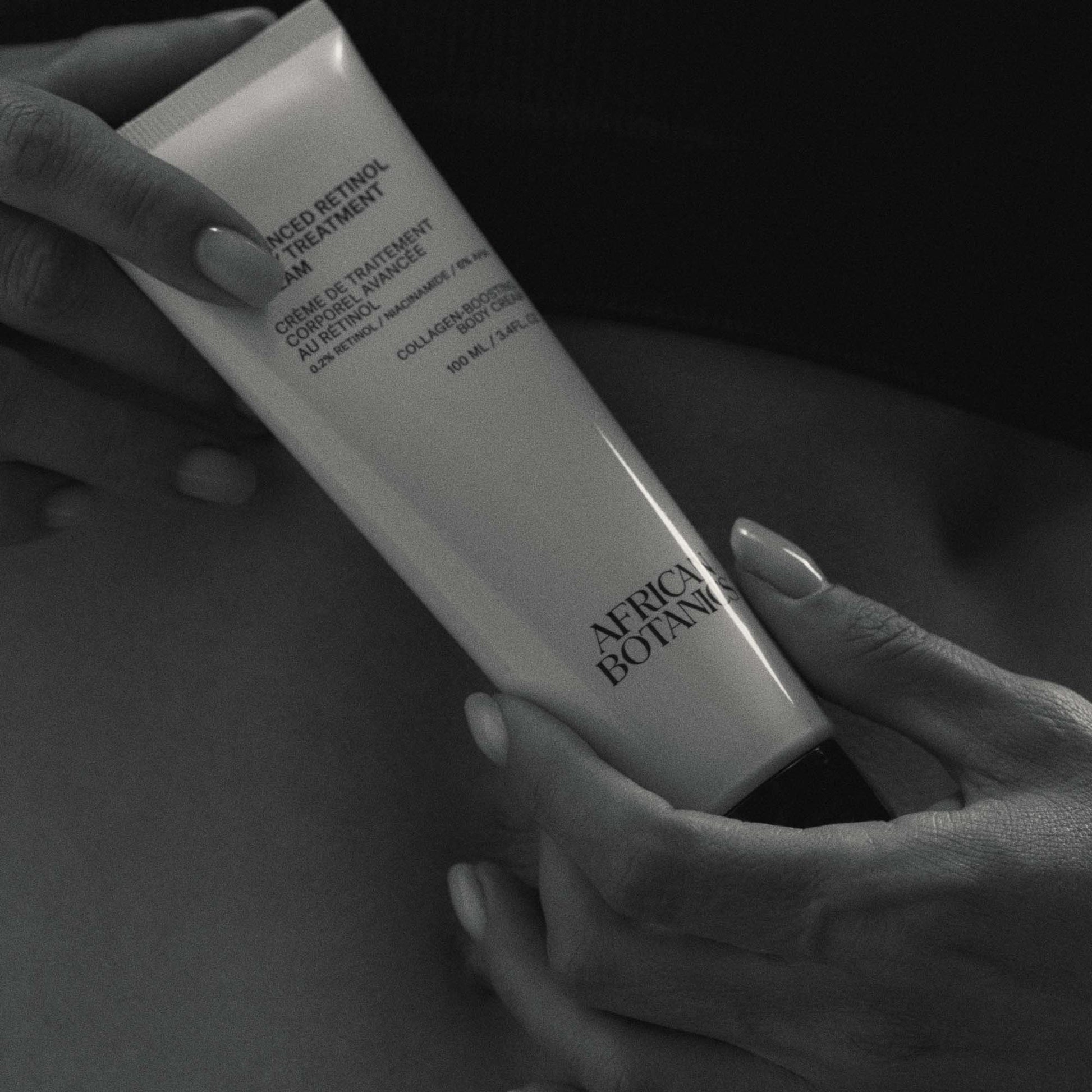 applying retinol body cream to improve skin texture and firmness on arms and legs