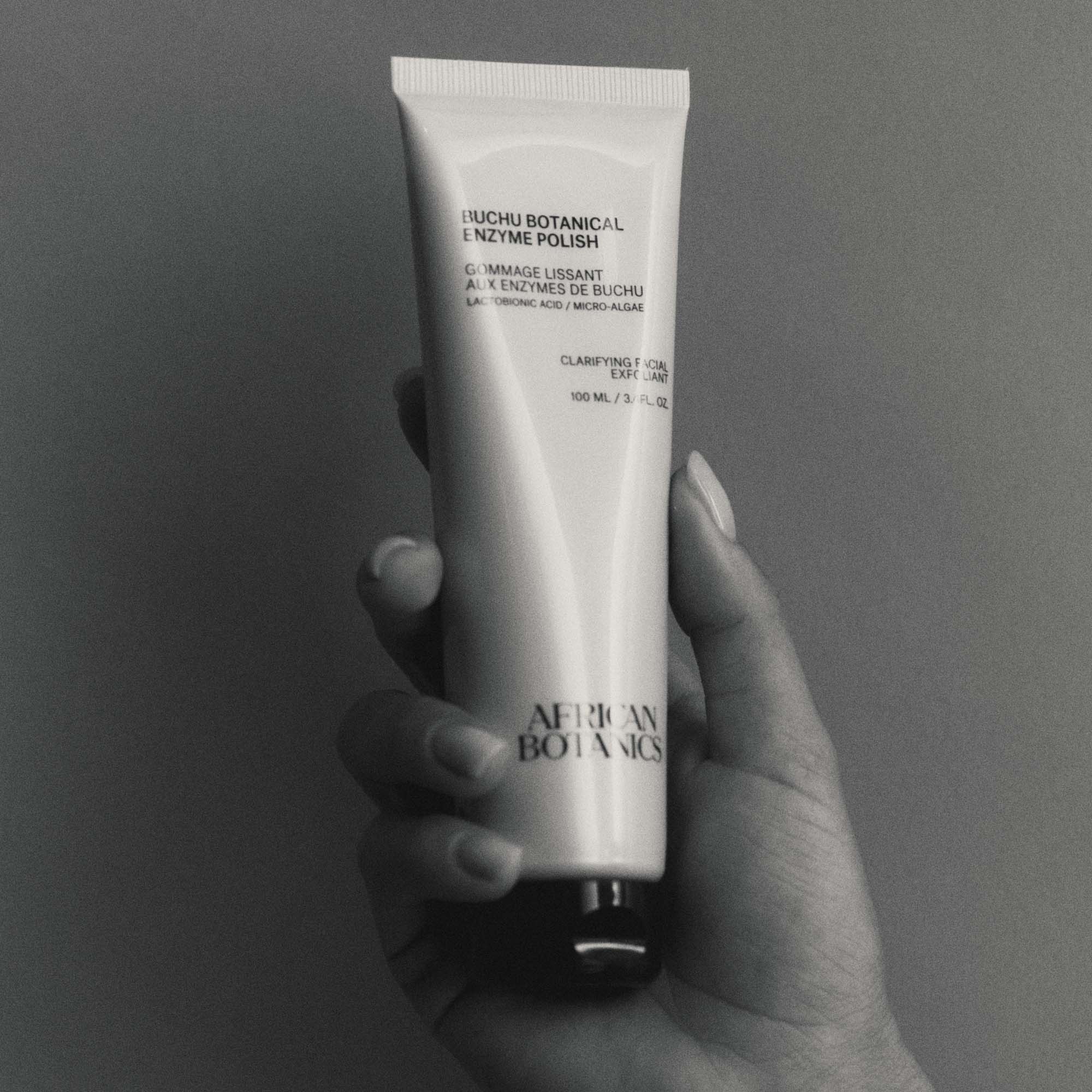 African Botanics Buchu Botanical Enzyme Polish applied to skin — gentle yet effective facial scrub suitable for sensitive, oily, and blemish-prone skin