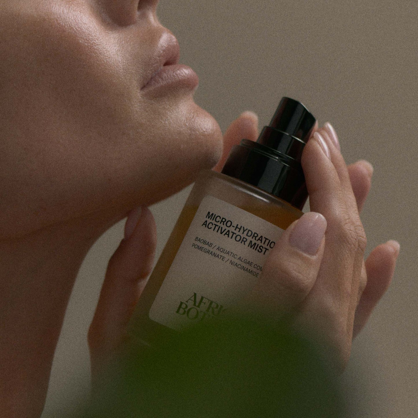 African Botanics Micro-Hydration Activator Mist applied to glowing, hydrated skin