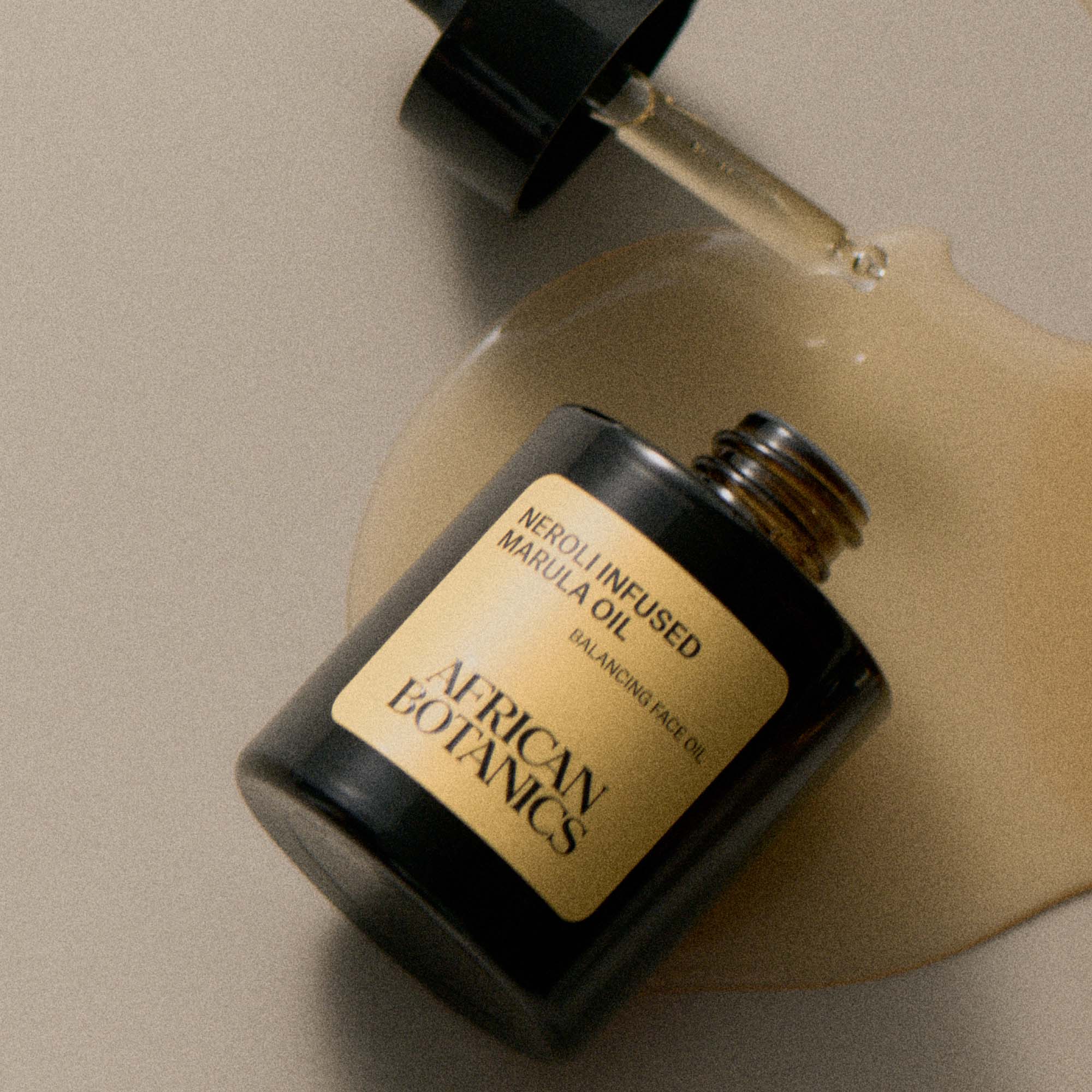 Lightweight golden texture of African Botanics Neroli Infused Marula Oil, fast-absorbing and non-comedogenic