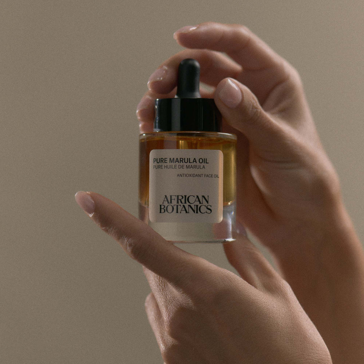 African Botanics Pure Marula Oil application — non-comedogenic luxury face oil for sensitive, dry, and mature skin types