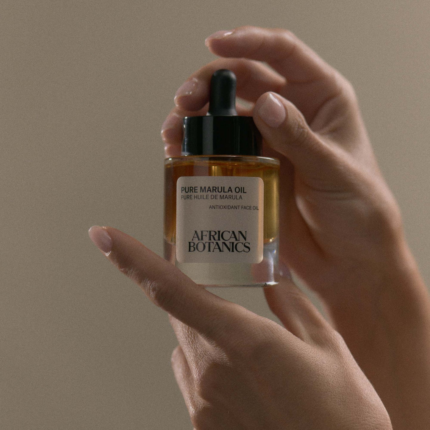 African Botanics Pure Marula Oil application — non-comedogenic luxury face oil for sensitive, dry, and mature skin types