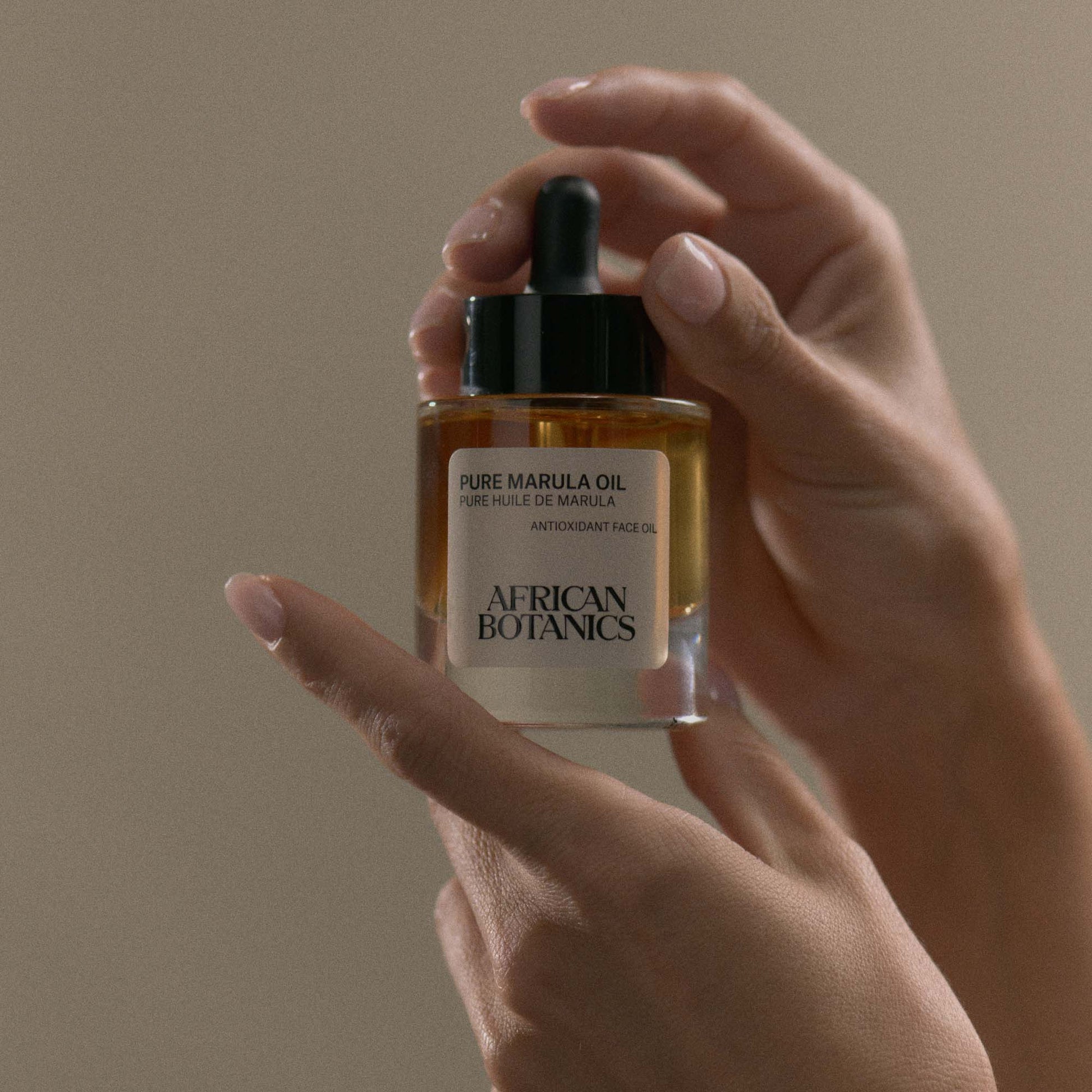 African Botanics Pure Marula Oil application — non-comedogenic luxury face oil for sensitive, dry, and mature skin types
